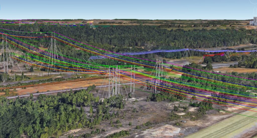 A 3D aerial view of a forested landscape with color-coded, digitally overlaid power lines and pylons crossing the area.