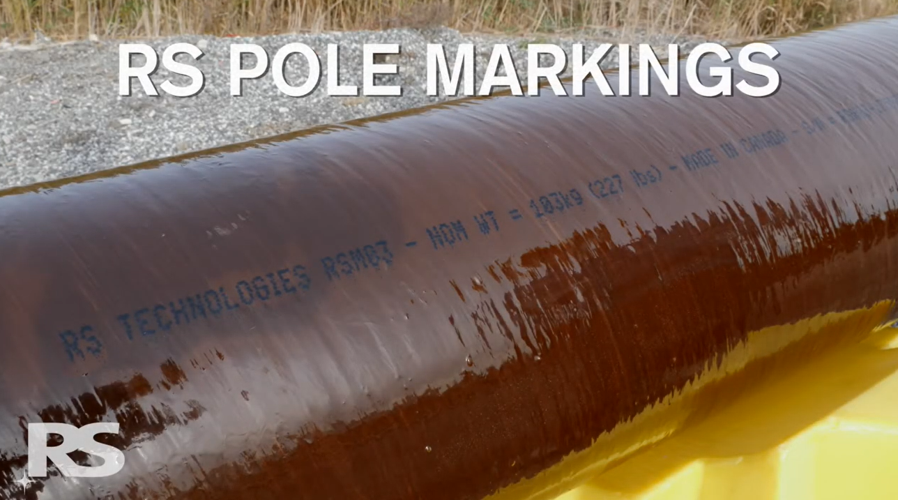 A brown utility pole with RS TECHNOLOGIES RSN07 and specifications printed on it. The text RS POLE MARKINGS is overlaid at the top. Grass and gravel are in the background.